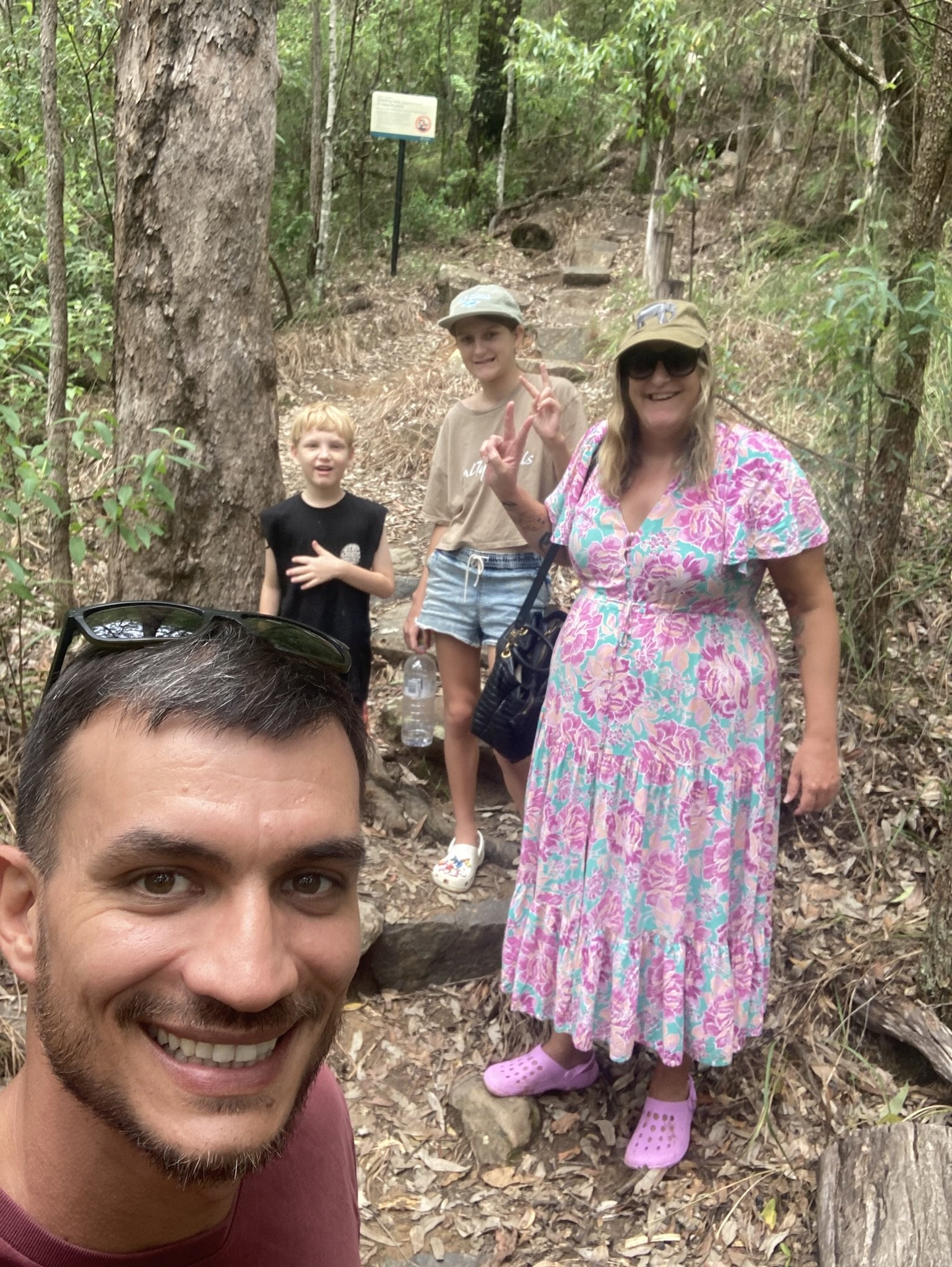 A support worker and participants on a bush walk